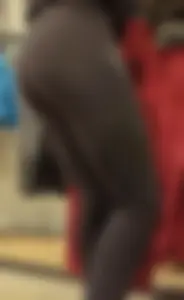 Skinny sports store employee in yoga pants