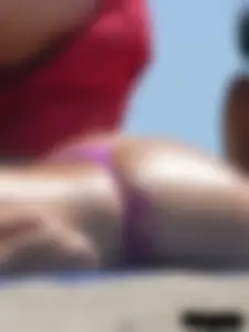 Purple thong topless lady on the beach gets oiled up by her husband
