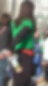 Sexy brunette in see thru leggings stretching before a run with a green thong