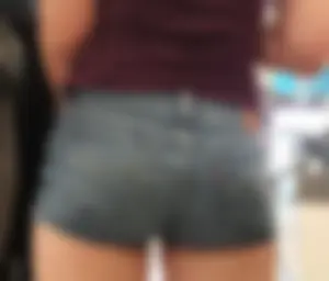 Teen in jean short shorts standing in line