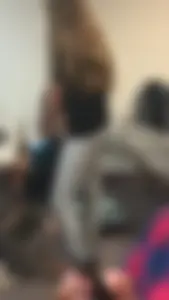 Skinny college girl in grey leggings in class
