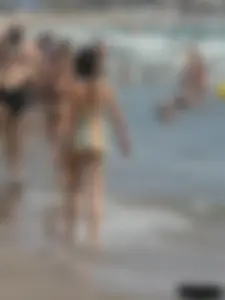 Bunch of sexy babes at the beach in thong bikinis