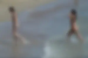 Girls on a nude beach in Sitges, Spain