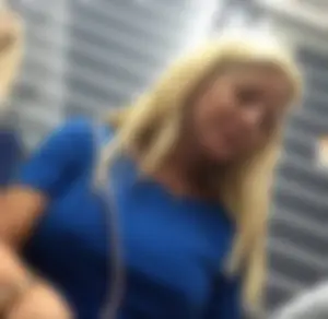 Blonde lady with big boobs showing pokies