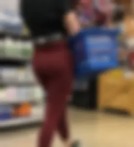 Girl with a nice ass in maroon leggings shopping