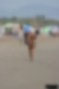 Tattooed blonde with big tits topless and in thong