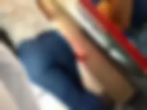 Train girl in tight jeans with a nice ass standing around