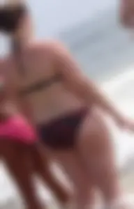 Fat chick with big boobs at the beach in a bikini