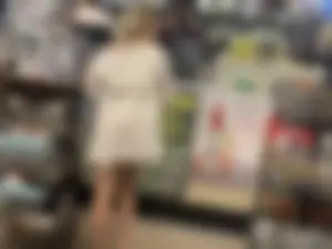 Cute blonde in a see through skirt showing her panties