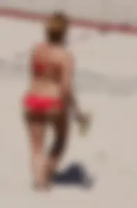 Redhead with nice ass and back dimples in red bikini on the beach