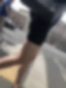 Great legs and booty in spandex shorts of a street candid girl crossing the street