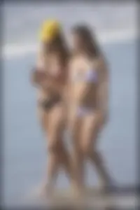 Two hot and sexy girls on the beach in thongs with incredible asses
