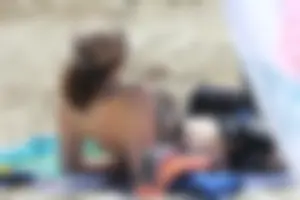 Sexy girls topless on a nude beach showing their nice tits