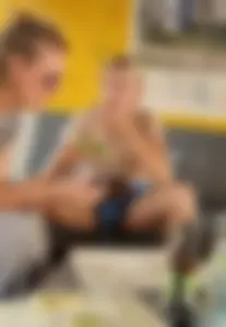 A Skinny Blonde Candid Teen in Shorts Sitting at the Table With Spread Legs Creepshots