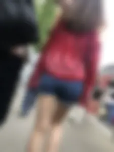 Very hot candid girl in denim shorts walking down the train platform