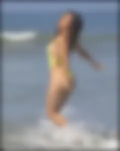 Sexy ass beach babe in a yellow thong swimsuit