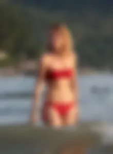 Skinny blonde babe in red bikini with camel toe and little pokies