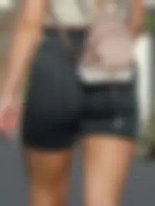 Blonde woman in lycra shorts - good front view, back view ruined by a bag
