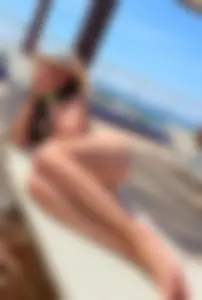 Amazingly Sexy Girl in Swimsuit Lying on the Sunbed