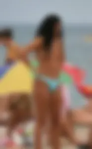 Beach voyeur girls in bikinis, thongs and topless