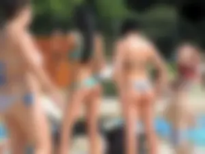 Tall and skinny brunette babe at the pool in a teal thong bikini