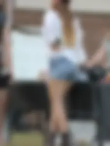 Hippie type dressed girl in denim shorts with a nice ass