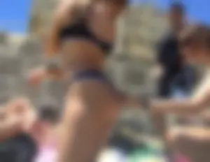 Girl Touching Another Girl's Booty in Swimsuit at the Beach Candid Photo