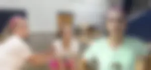 Bunch of cute college girls in bright pink shorts playing volleyball