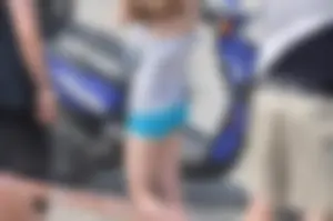Skinny babe with a cute little ass in tiny blue shorts