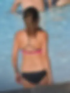 Asian milf in black and pink bikini at the beach