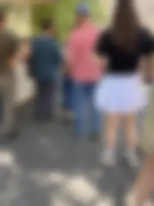 Closeups of a hot girl’s pale legs, she’s wearing a skirt