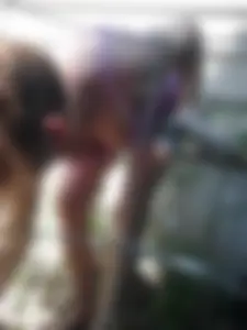 Skinny Girl Squatting While Working in a Garden in Shorts, Blouse and Slippers Downblouse Creepshots