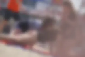 A group of teens in bikinis on the beach