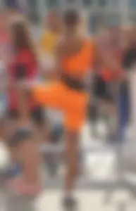 Athlete in Orange Spandex Outfit Stretching Legs VPL Candid Photos