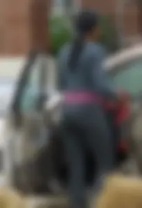 Ebony babe getting into her car with a great ass in grey leggings