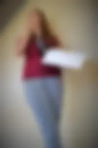 College student in grey leggings almost with camel toe showing