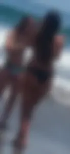 Thick brunette beach babe booty in a little black bikini