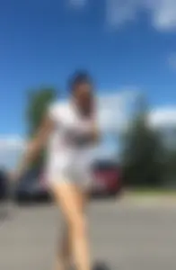 Sexy babe in short jeans shorts on the phone