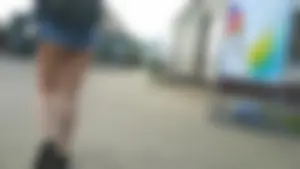 Girl walking in denim shorts showing some of her ass cheeks