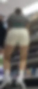 Amazing Asian in white yoga shorts upshot bends squat at Target