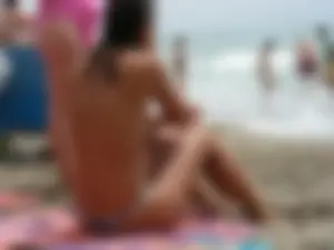 Hot topless girl on the beach in a thong bikini with a nice ass