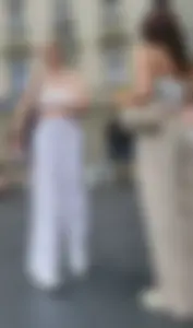 Long blonde braless in a white outfit (many pictures)