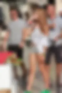 Sexy skinny blonde eating ice cream in short tight grey shorts