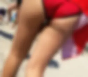 Candid beach Asian with a sexy little ass in a red swimsuit