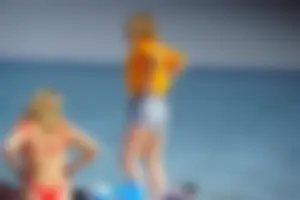 Hot blonde with a slammin body in red thong bikini on the beach