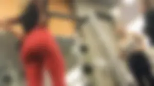 Very hot and sexy blonde at the gym working out in red leggings