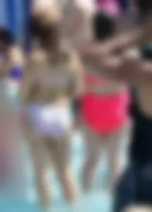 Two thick milfs at the pool in bikinis