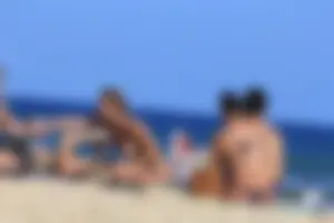 Sexy girls topless on a nude beach showing their nice tits