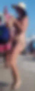 Cute girl on the beach with a decent body in thong bikini