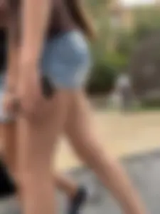 Candid teen wearing denim shorts passing by, nice legs